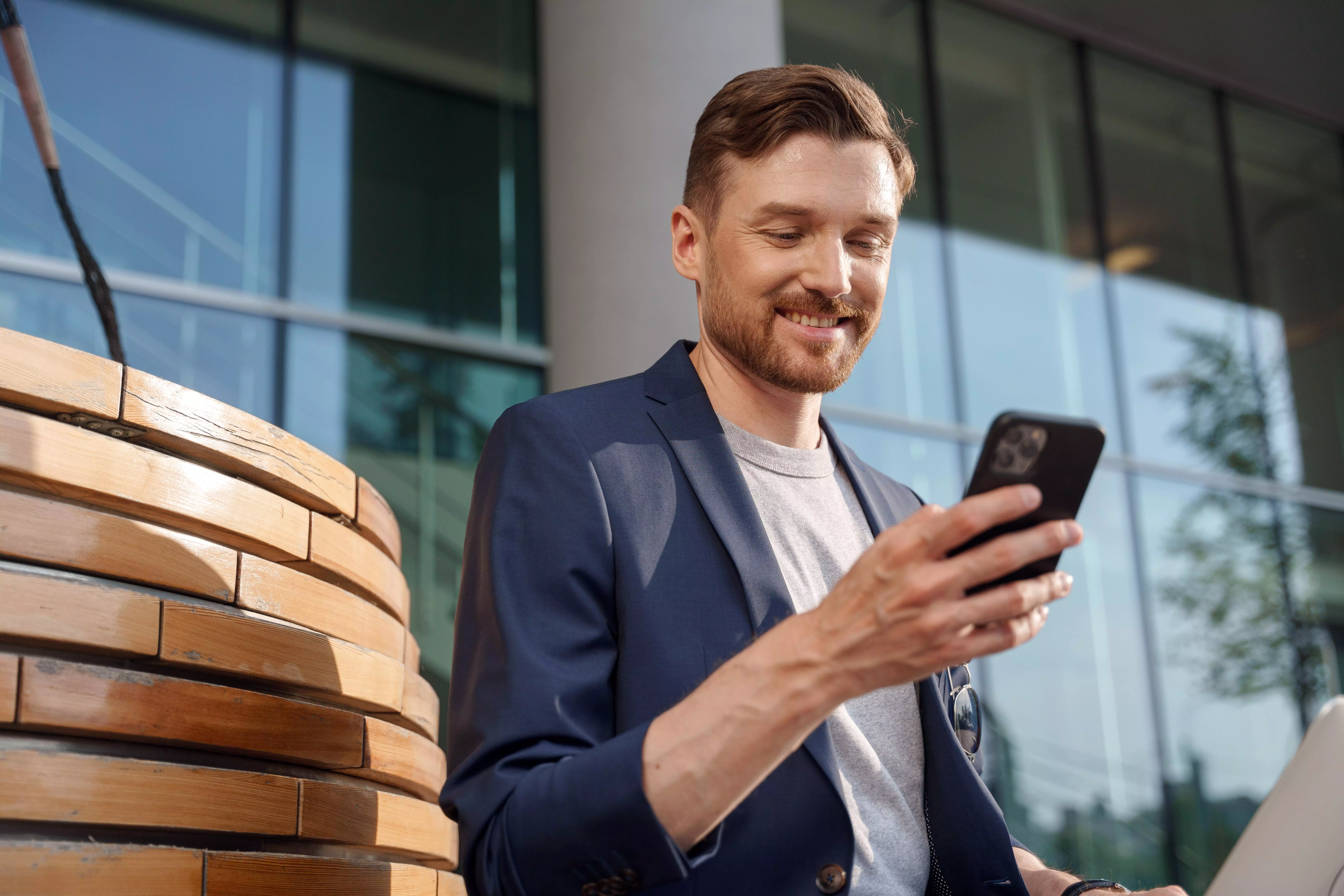 A picture of a person watching his phone