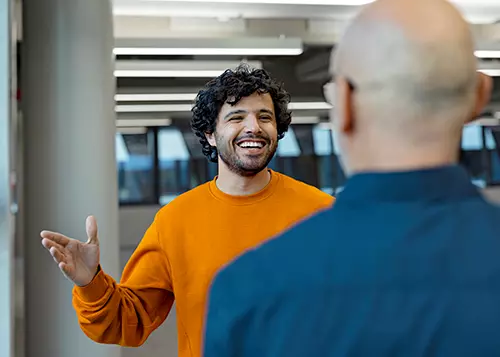 Two men are talking at the office